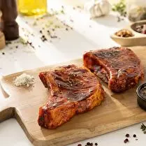 Votre boucher propose, Produit élaboré : Côte de porc avec os marinée à l'Andalouse à griller x 4